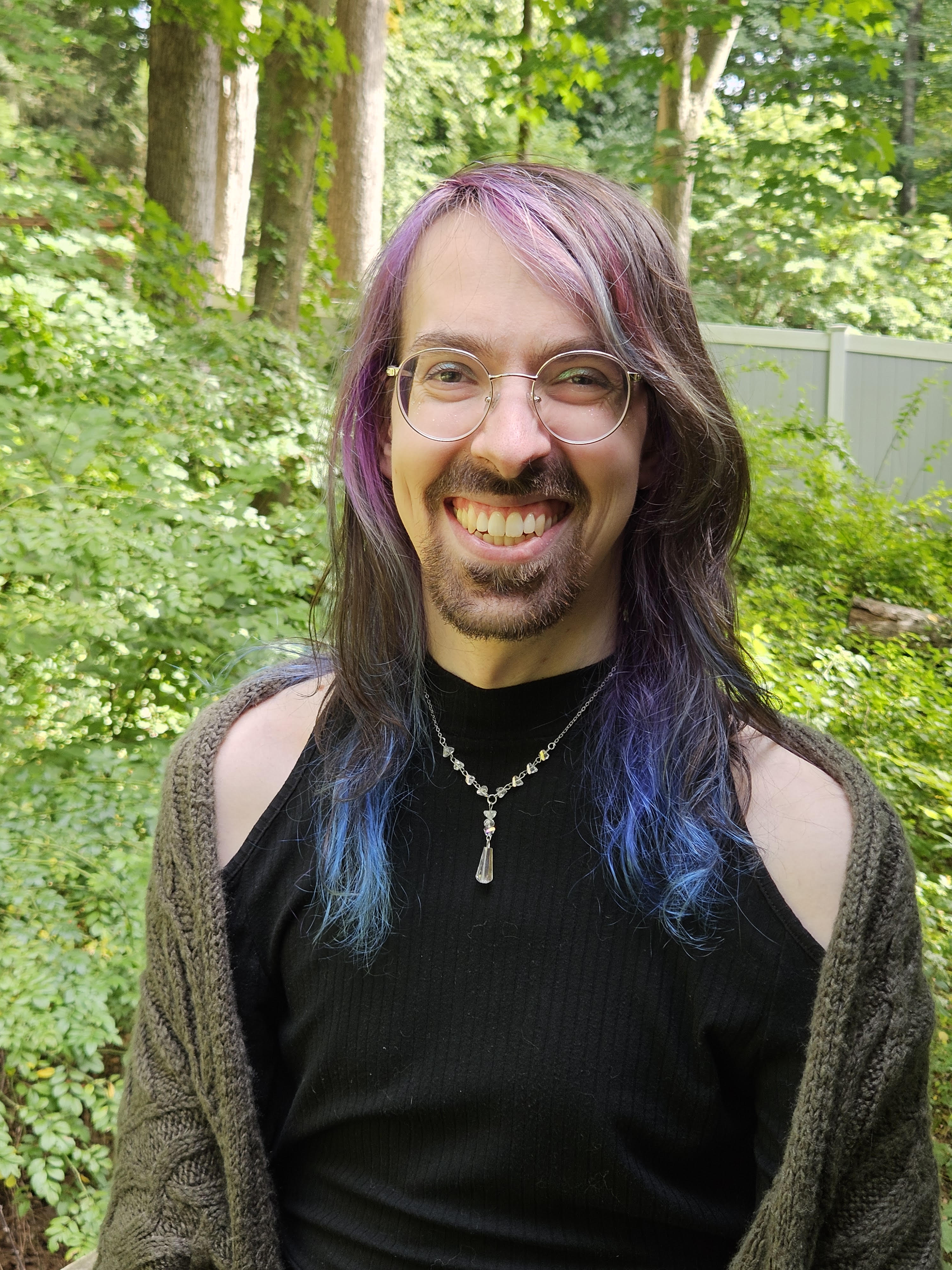 Portrait of Patrick Belanger smiling outdoors